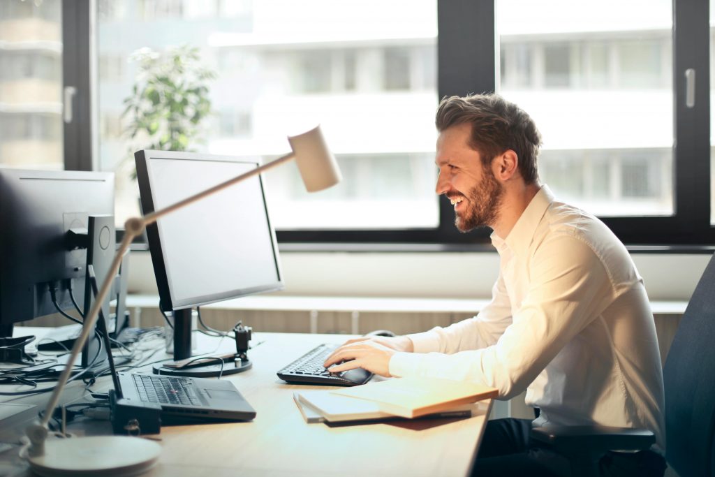 Man on computer using lockdown for schools system